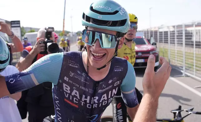 Belgium's Alec Segaert of Bahrain Victorious celebrates winning the 12th stage of the Giro d'Italia cycling race, from Imperia to Novi Ligure, Italy, Thursday, May 21, 2026. (Marco Alpozzi/LaPresse via AP)