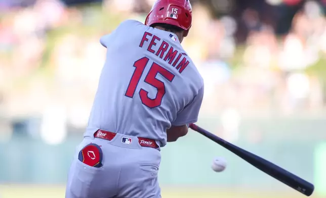 St. Louis Cardinals' José Fermín hits an two RBI double during the first inning of a baseball game against the Athletics Tuesday, May 12, 2026, in West Sacramento, Calif. (AP Photo/Scott Marshall)