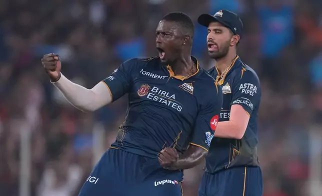 Gujarat Titans' Jason Holder celebrates the wicket of Royal Challengers Bengaluru's Jitesh Sharma during the Indian Premier League cricket match between Gujarat Titans and Royal Challengers Bengaluru in Ahmedabad, India, Thursday, April 30, 2026. (AP Photo/Ajit Solanki)