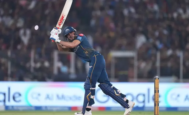 Gujarat Titans' captain Shubman Gill hits a six during the Indian Premier League cricket match between Gujarat Titans and Royal Challengers Bengaluru in Ahmedabad, India, Thursday, April 30, 2026. (AP Photo/Ajit Solanki)