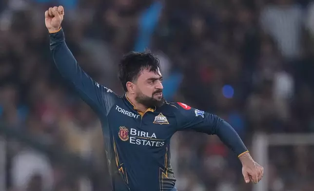 Gujarat Titans' Rashid Khan celebrates the wicket of Royal Challengers Bengaluru's Devdutt Padikkal during the Indian Premier League cricket match between Gujarat Titans and Royal Challengers Bengaluru in Ahmedabad, India, Thursday, April 30, 2026. (AP Photo/Ajit Solanki)