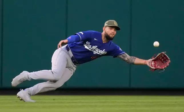 Los Angeles Dodgers center fielder Andy Pages makes a catch on a ball hit by Los Angeles Angels' Nolan Schanuel during the fourth inning of a baseball game Saturday, May 16, 2026, in Anaheim, Calif. (AP Photo/Mark J. Terrill)