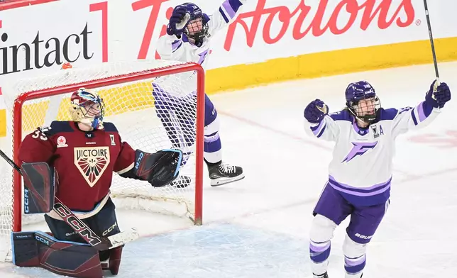 Montreal Victoire goaltender Ann-Renee Desbiens (35) looks as Minnesota Frost's Kelly Pannek (12) and Grace Zumwinkle (13) celebrate a goal by teammate Jincy Roese (not shown) during the overtime of an PWHL playoff hockey game in Laval, Que., Saturday, May 2, 2026. (Graham Hughes/The Canadian Press via AP)