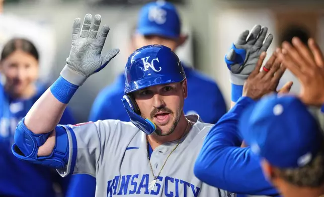 Kansas City Royals' Vinnie Pasquantino celebrates in the dugout after hitting a solo home run against the Seattle Mariners during the sixth inning of a baseball game, Friday, May 1, 2026, in Seattle. (AP Photo/Lindsey Wasson)