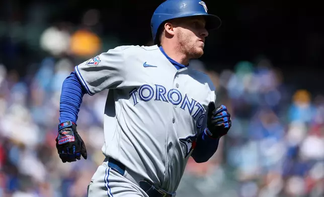 Toronto Blue Jays' Myles Straw runs the baes after hitting a solo home run in the second inning of a baseball game against the Minnesota Twins, Saturday, May 2, 2026, in Minneapolis. (AP Photo/Matt Krohn)