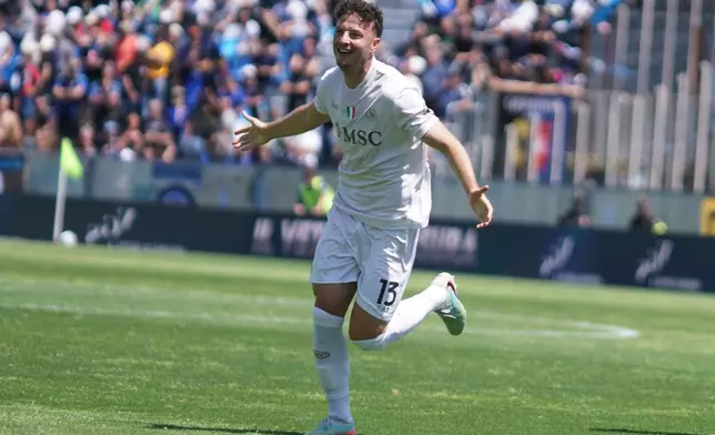 Napoli's Amir Rrahmani celebrates after scoring during the Serie A soccer match between Pisa and Napoli in Pisa, Italy, Sunday May 17 2026. (Alessandro La Rocca/LaPresse via AP)