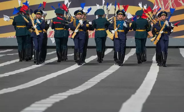 Honour guard soldiers perform with rifles during a rehearsal for the Victory Day military parade at the Dvortsovaya (Palace) Square in St. Petersburg, Russia, Tuesday, May 5, 2026. (AP Photo/Dmitri Lovetsky)