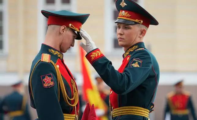 Honour guard soldiers prepare for a rehearsal for the Victory Day military parade at the Dvortsovaya (Palace) Square in St. Petersburg, Russia, Tuesday, May 5, 2026. (AP Photo/Dmitri Lovetsky)