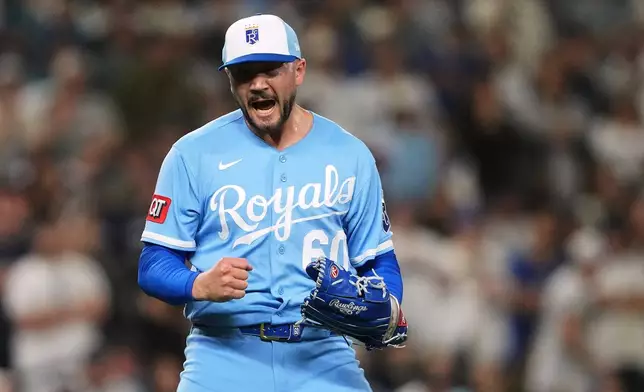 Kansas City Royals relief pitcher Lucas Erceg reacts to earning the save in a win in 10 innings over the Seattle Mariners in a baseball game, Saturday, May 2, 2026, in Seattle. (AP Photo/Lindsey Wasson)