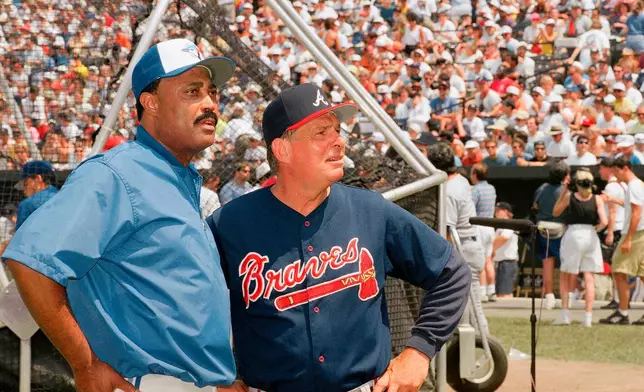 FILE - National League manager Bobby Cox, right, and American League manager Cito Gaston look over Camden Yards during All-Star workouts in Baltimore, Md., July 13, 1993. (AP Photo/Carlos Osorio, File)