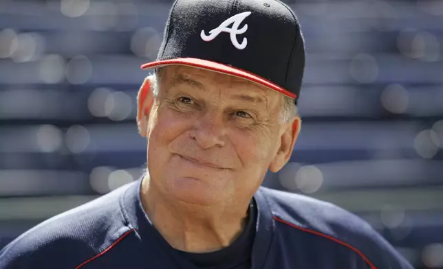 FILE - Atlanta Braves manager Bobby Cox smiles while talking to reporters during team practice at Turner Field in Atlanta, Oct. 4, 2005. (AP Photo/Ed Reinke, File)