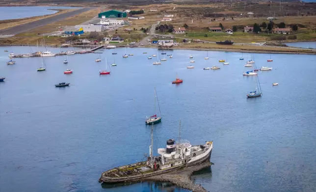 Boats sit in the dock in Ushuaia, Argentina, Thursday, May 14, 2026. (AP Photo/Joel Reyero)