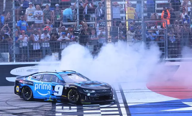 Chase Elliott does a burnout at the finish line after winning a NASCAR Cup Series auto race in Fort Worth, Texas, Sunday, May 3, 2026. (AP Photo/LM Otero)