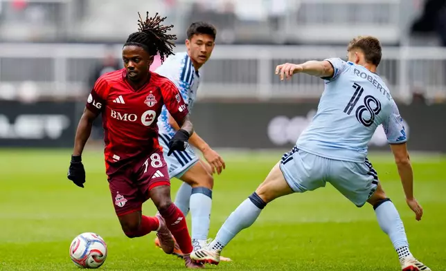 Toronto FC midfielder Malik Henry (78) dribbles past San Jose Earthquakes defender Reid Roberts (18) during the first half of an MLS soccer game in Toronto, Saturday, May 2, 2026. (Frank Gunn/The Canadian Press via AP)
