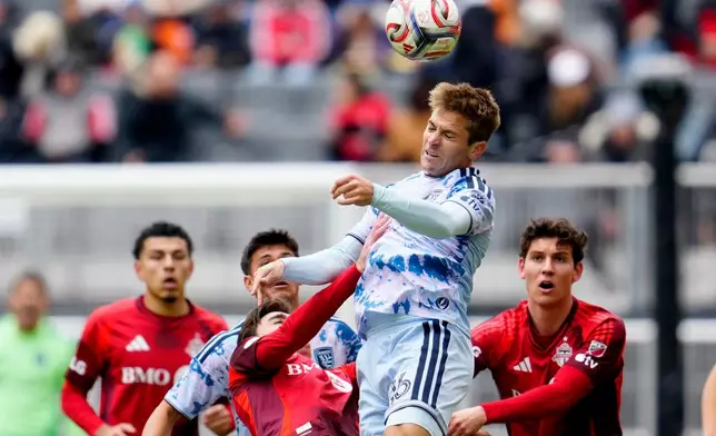 San Jose Earthquakes midfielder Jack Skahan (16) heads the ball as Toronto FC players look on during the first half of an MLS soccer game in Toronto, Saturday, May 2, 2026. (Frank Gunn/The Canadian Press via AP)