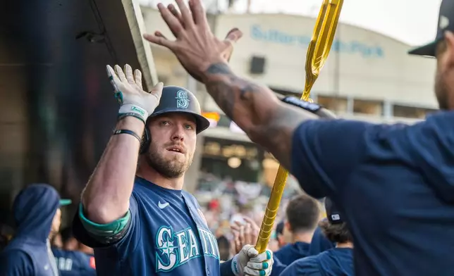 Seattle Mariners' Luke Raley celebrates after hitting a home run during the third inning of a baseball game against the Athletics in West Sacramento, Calif., Monday, May 25, 2026. (AP Photo/Nic Coury)