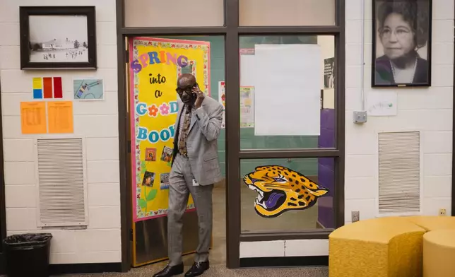 Birmingham City Schools Superintendent, Dr. Mark A. Sullivan, takes a call as he enters the library at Oxmoor Valley Elementary School in Birmingham, Ala., Wednesday, May 6, 2026. (Will McLelland/AL.com via AP)