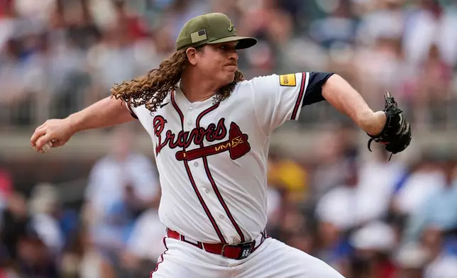 Atlanta Braves pitcher Grant Holmes (66) works in the first inning of a baseball game against the Boston Red Sox, Sunday, May 17, 2026, in Atlanta. (AP Photo/Mike Stewart)