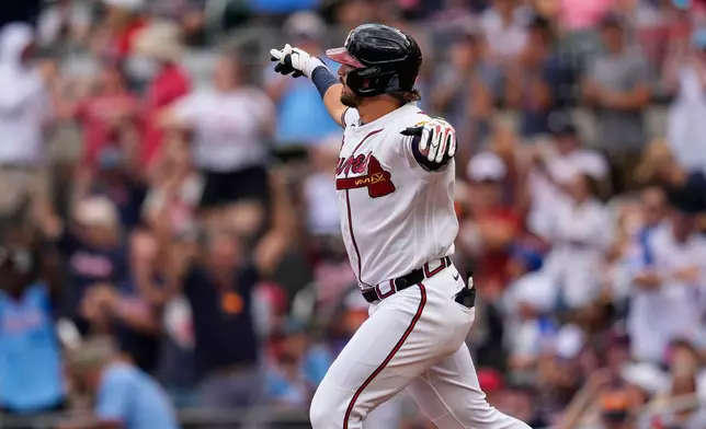 Atlanta Braves third baseman Austin Riley celebrates his three-run homer against the Boston Red Sox in the first inning of a baseball game, Sunday, May 17, 2026, in Atlanta. (AP Photo/Mike Stewart)