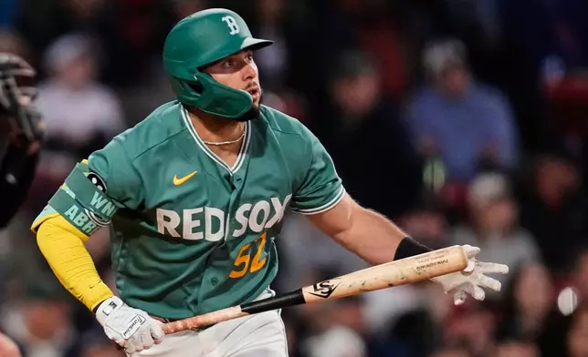 Boston Red Sox's Wilyer Abreu watches the flight of his solo home run during the third inning of a baseball game against the Tampa Bay Rays, Friday, May 8, 2026, in Boston. (AP Photo/Charles Krupa)