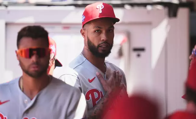 Philadelphia Phillies starting pitcher Cristopher Sánchez pats his chest at the end of the fourth inning of a baseball game against the San Diego Padres Wednesday, May 27, 2026, in San Diego. (AP Photo/Gregory Bull)