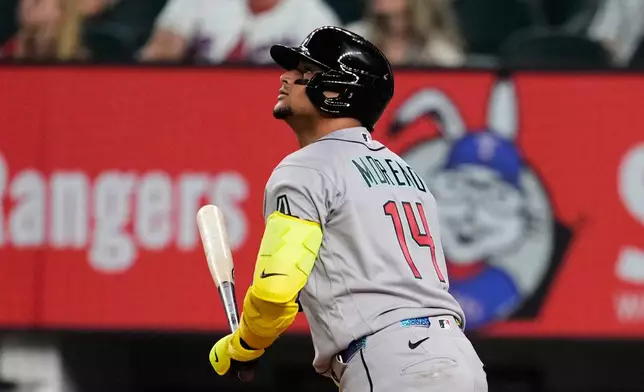Arizona Diamondbacks' Gabriel Moreno watches his sacrifice fly that scored Nolan Arenado in the ninth inning of a baseball game against the Texas Rangers Tuesday, May 12, 2026, in Arlington, Texas. (AP Photo/Tony Gutierrez)