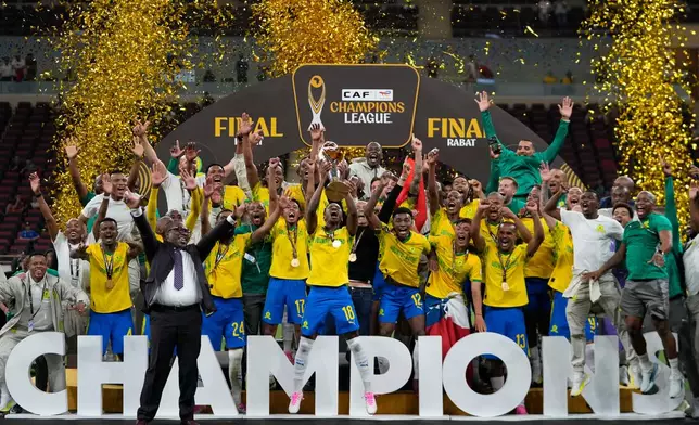 Mamelodi Sundowns' team celebrates after winning the CAF Champions League final soccer match between AS FAR Rabat and Mamelodi Sundowns, in Rabat, Morocco, Sunday, May 24, 2026. (AP Photo/Mosa'ab Elshamy)