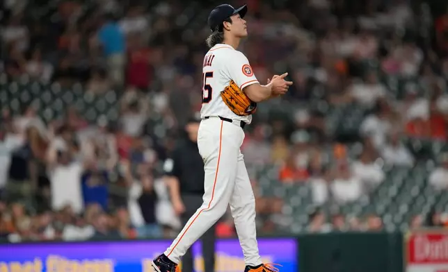 Houston Astros starting pitcher Tatsuya Imai looks to the scoreboard after giving up a grand slam to Seattle Mariners' Dominic Canzone during the fourth inning of a baseball game Tuesday, May 12, 2026, in Houston. (AP Photo/David J. Phillip)