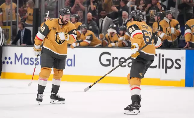 Vegas Golden Knights center Tomas Hertl, left, celebrates his goal with right wing Mark Stone during the third period in Game 3 of the Western Conference finals NHL hockey Stanley Cup playoff series against the Colorado Avalanche, Sunday, May 24, 2026, in Las Vegas. (AP Photo/Mark J. Terrill)