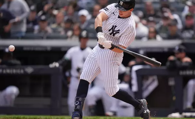 New York Yankees' Ben Rice hits a home run during the first inning of a baseball game against the Baltimore Orioles, Sunday, May 3, 2026, in New York. (AP Photo/Seth Wenig)
