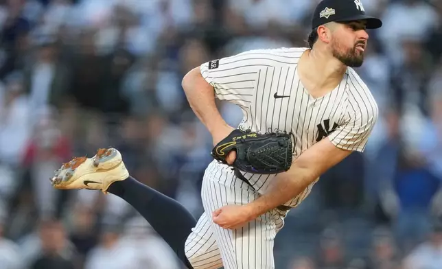FILE - New York Yankees pitcher Carlos Rodón delivers against the Boston Red Sox during the first inning of Game 2 of an American League wild-card baseball playoff series, Oct. 1, 2025, in New York. (AP Photo/Yuki Iwamura, File)