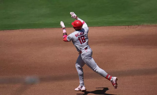 Jordan Walker celebrates his two-run home run during the fourth inning of a baseball game against the San Diego Padres Sunday, May 10, 2026, in San Diego. (AP Photo/Gregory Bull)