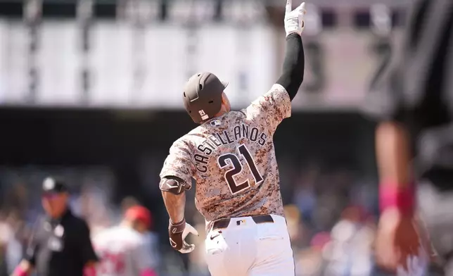 San Diego Padres' Nick Castellanos celebrates his two-run home run during the ninth inning of a baseball game against the St. Louis Cardinals Sunday, May 10, 2026, in San Diego. (AP Photo/Gregory Bull)