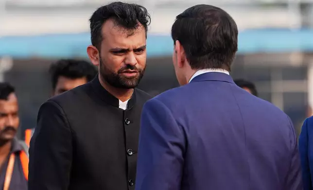 United States Secretary of State Marco Rubio is greeted by West Bengal state's Chief of Protocol, Avadh Singhal, left, after disembarking his plane at Netaji Subhash Chandra Bose International Airport in Kolkata, India, Saturday, May 23, 2026. (AP Photo/Julia Demaree Nikhinson, Pool)