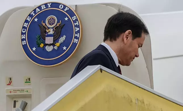 Secretary of State Marco Rubio boards his plane at Malmo Airport, Friday, May 22, 2026, in Malmo-Sturup, Sweden. (AP Photo/Julia Demaree Nikhinson, Pool)