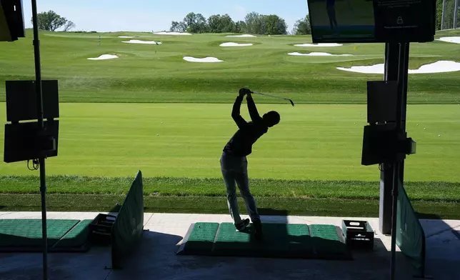 Seiji Sako hits at the driving range at the Cobbs Creek Golf Club in Philadelphia, Tuesday, May 12, 2026. (AP Photo/Matt Rourke)