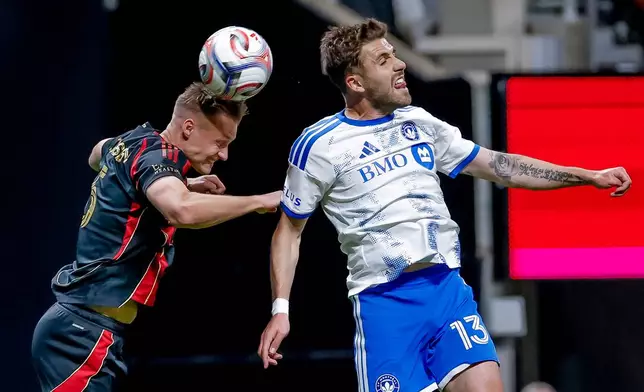 CF Montreal defender Luca Petrasso (13) batles against Atlanta United defender Stian Gregersen, left, during the first half of an MLS soccer match, Saturday, May 2, 2026, in Atlanta. (AP Photo/Erik S. Lesser)