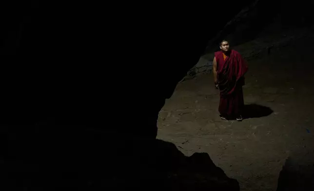 Jalue Dorje visits the Maratika Caves that are sacred to Hindus and Buddhists, in eastern Nepal, Monday, April 13, 2026. (AP Photo/Niranjan Shrestha)