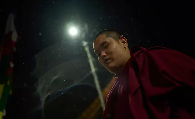 Jalue Dorje circumambulates the World Heritage site Boudhanath Stupa in Kathmandu, Nepal, Monday, April 6, 2026. (AP Photo/Niranjan Shrestha)