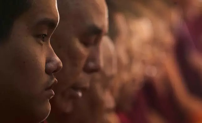 Jalue Dorje attends rituals with other monks at Dzarong Thubten Mindrol Dongä Chöling Monastery in Kathmandu, Nepal, Tuesday, April 14, 2026. (AP Photo/Niranjan Shrestha)