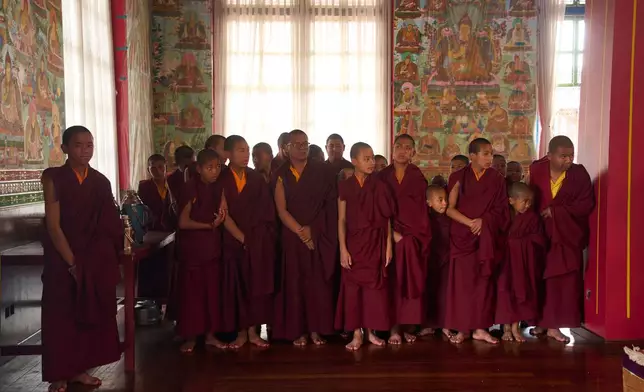 Buddhist monks attend a ritual at Dzarong Thubten Mindrol Dongä Monastery in Kathmandu, Nepal, Tuesday, April 14, 2026. (AP Photo/Niranjan Shrestha)
