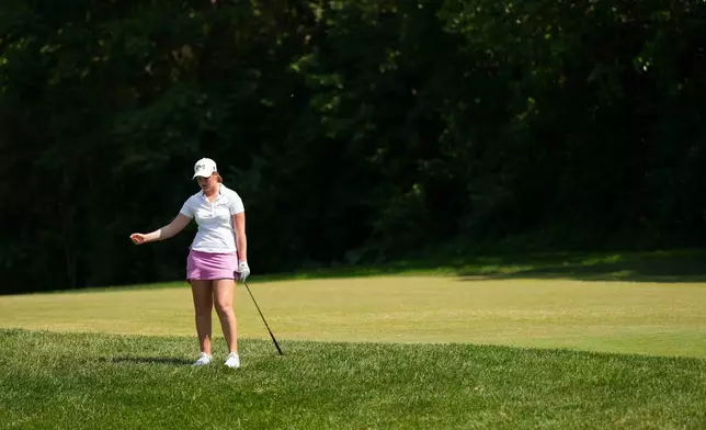Lottie Woad reacts hitting on the sixth hole during the final round of the Queen City Championship LPGA golf tournament at Maketewah Country Club, Sunday, May 17, 2026, in Cincinnati. (AP Photo/Jeff Dean)