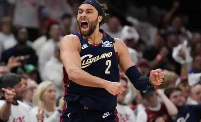 Cleveland Cavaliers guard Max Strus (2) celebrates a turnover by the Detroit Pistons in the first half of Game 3 of a second-round NBA playoffs basketball series Saturday, May 9, 2026 in Cleveland. (AP Photo/Sue Ogrocki)