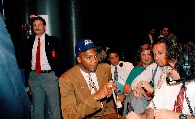 FILE - Derrick Coleman, the first NBA draft choice, has a radio interview in New York, June 28, 1990, in New York. (AP Photo/Susan Ragan)