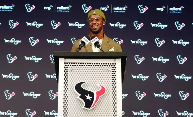 Houston Texans' Azeez Al-Shaair talks about his contract extension during a press conference at the NFL football team's facility, Friday, May 1, 2026, in Houston. (AP Photo/Karen Warren)