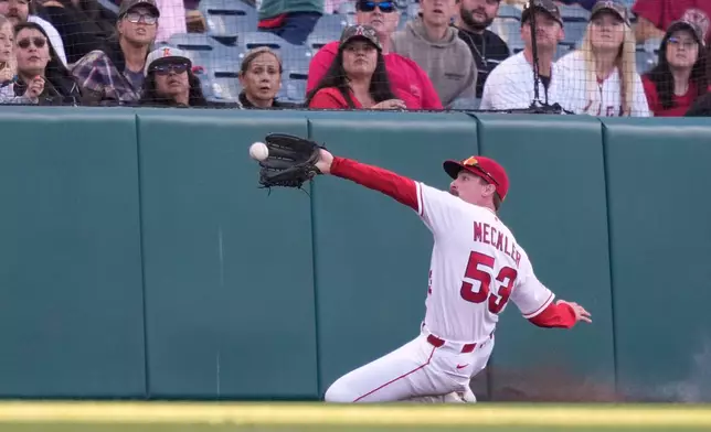 Los Angeles Angels left fielder Wade Meckler makes a catch on a foul ball hit by Texas Rangers' Brandon Nimmo during the first inning of a baseball game Friday, May 22, 2026, in Anaheim, Calif. (AP Photo/Mark J. Terrill)