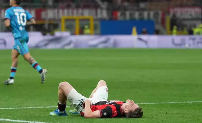 AC Milan's Alexis Saelemaekers reacts at the end of the Serie A soccer match between AC Milan and Cagliari, in Milan, Italy, Sunday, May 24, 2026. (AP Photo/Antonio Calanni)