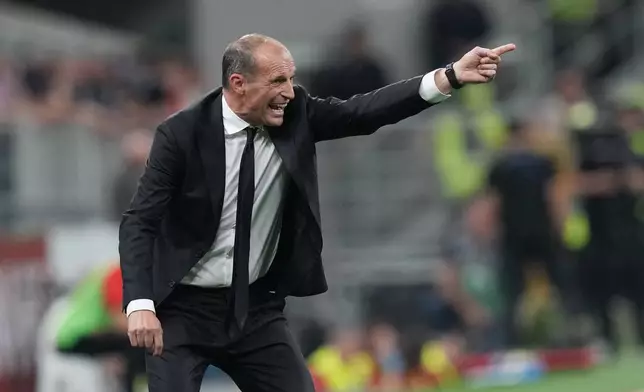 AC Milan's head coach Massimiliano Allegri gives instructions during the Serie A soccer match between AC Milan and Cagliari, in Milan, Italy, Sunday, May 24, 2026. (AP Photo/Antonio Calanni)