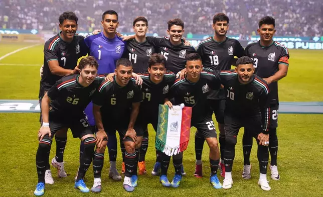 Mexico team pose for a group photo prior to an international friendly soccer match against Ghana in Puebla, Mexico, Friday, May 22, 2026. (AP Photo/Fernando Llano)