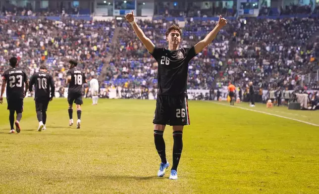 Mexico's Brian Gutiérrez celebrates scoring his side's opening goal against Ghana during an international friendly soccer match in Puebla, Mexico, Friday, May 22, 2026. (AP Photo/Fernando Llano)